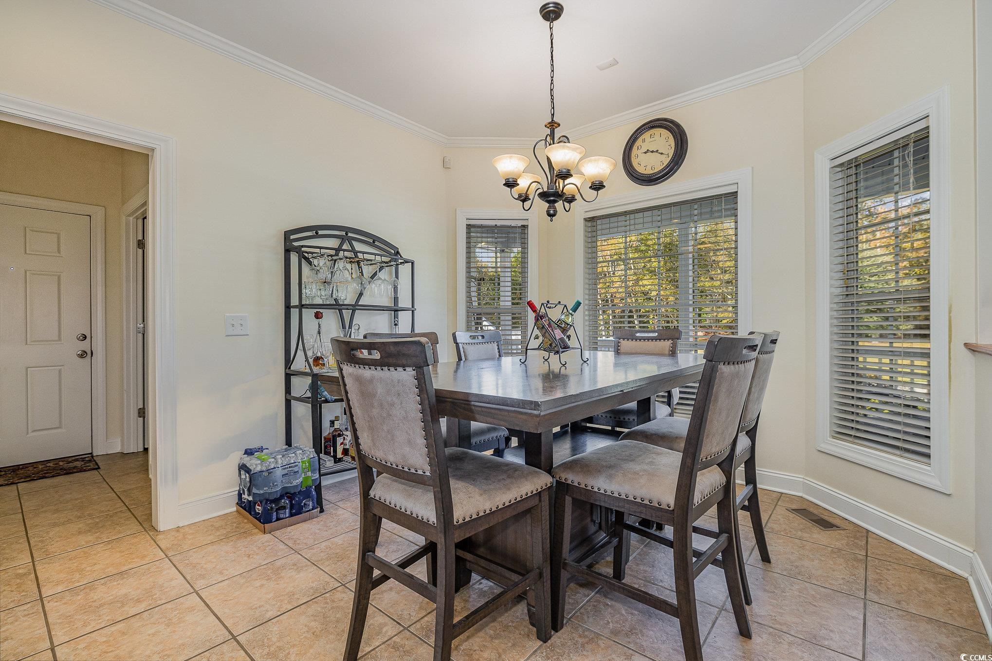 1555 Big Swamp Road Pamplico, SC 29583 - Photo 35 of 40 Dining area, a wealth of natural light, and crown molding