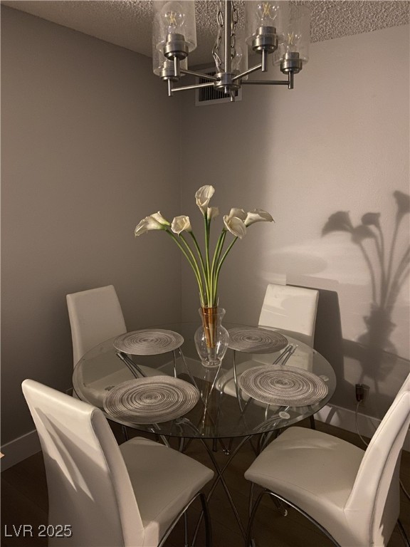750 South Royal Crest Circle, Unit 342 Las Vegas, NV 89169 - Photo 10 of 21 Dining room with a chandelier and a textured ceiling