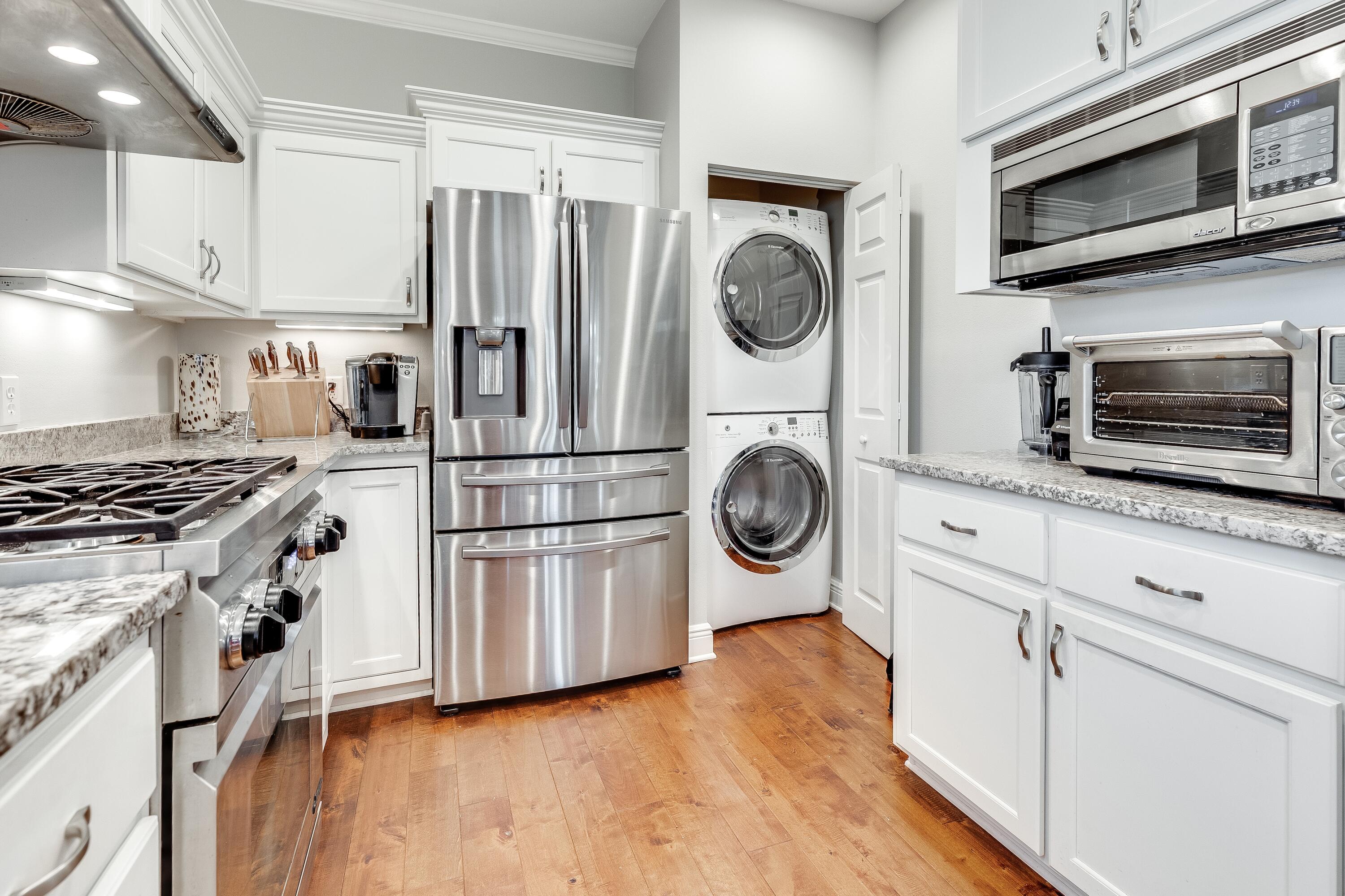 51 Vantage Point Miramar Beach, FL 32550 - Photo 13 of 64 a kitchen with stainless steel appliances a stove a refrigerator and a microwave