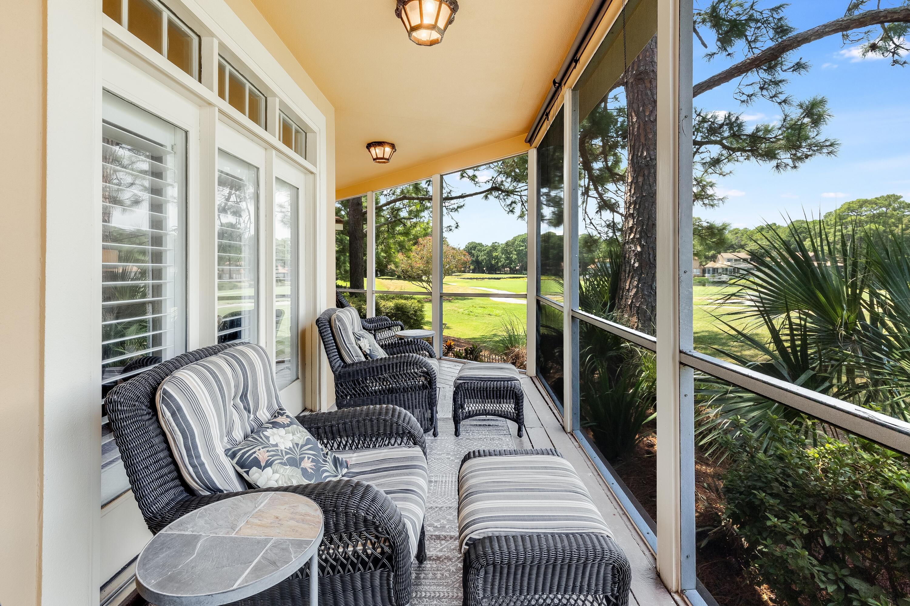 51 Vantage Point Miramar Beach, FL 32550 - Photo 20 of 64 a balcony with furniture and a potted plant