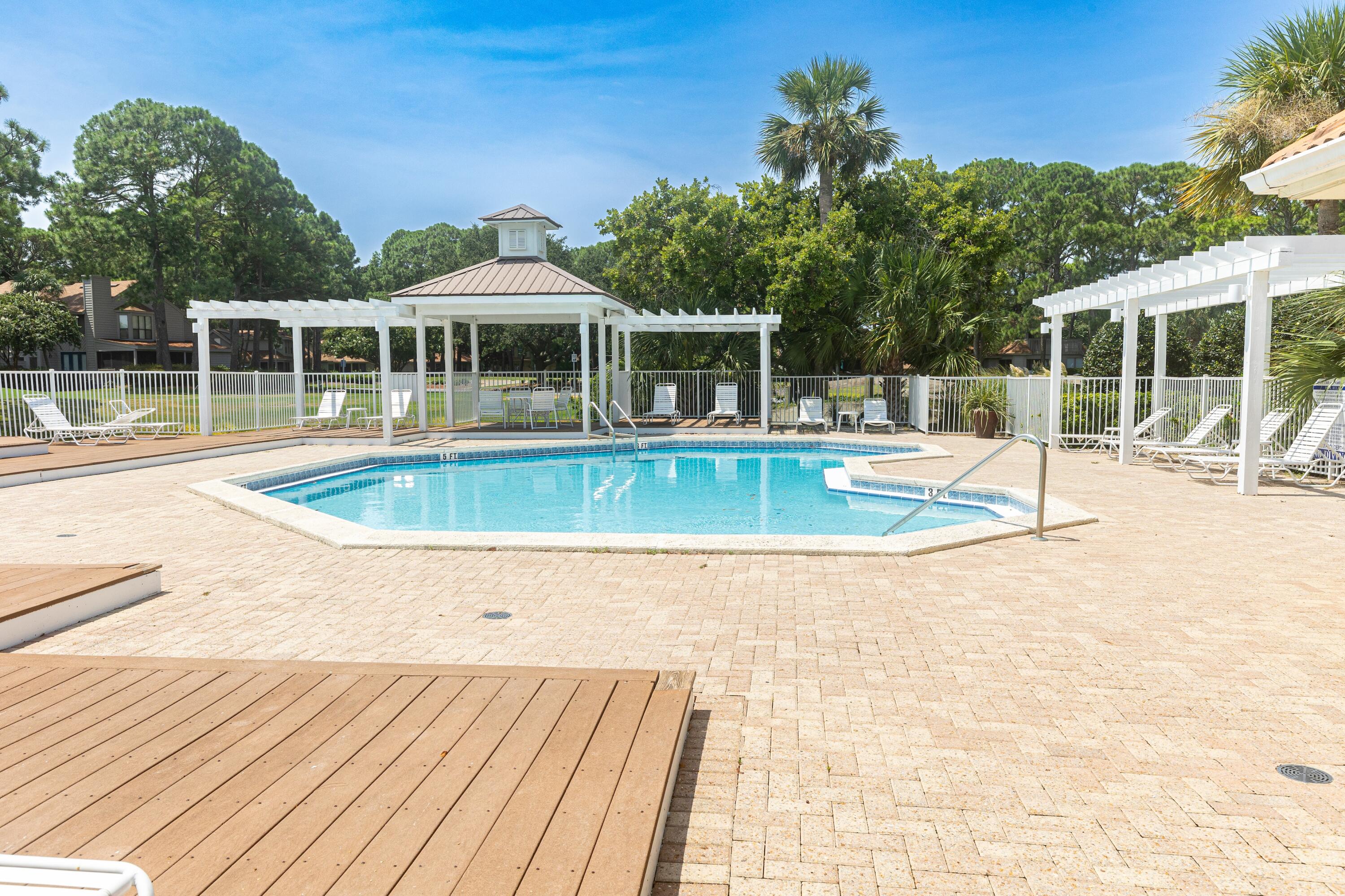 51 Vantage Point Miramar Beach, FL 32550 - Photo 49 of 64 a view of a house with a swimming pool