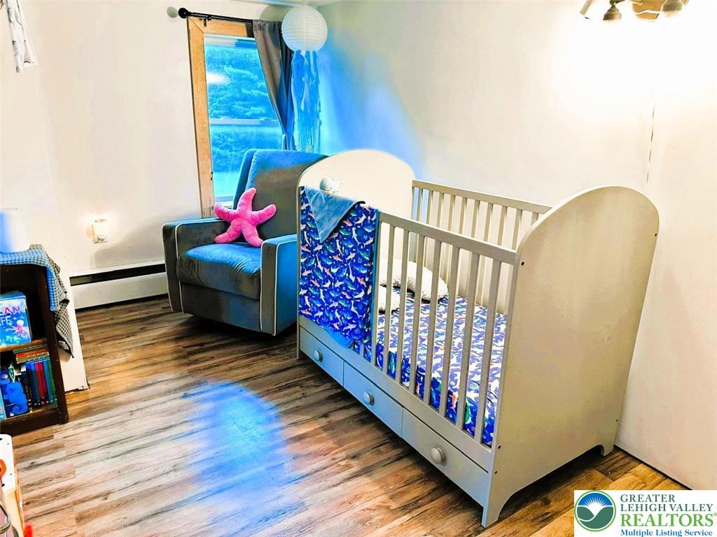 1250 Myrtle Road Walnutport, PA 18088 - Photo 17 of 30 a bedroom with furniture and wooden floor