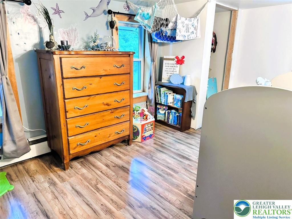 1250 Myrtle Road Walnutport, PA 18088 - Photo 18 of 30 a view of a bedroom with baby crib and cabinet