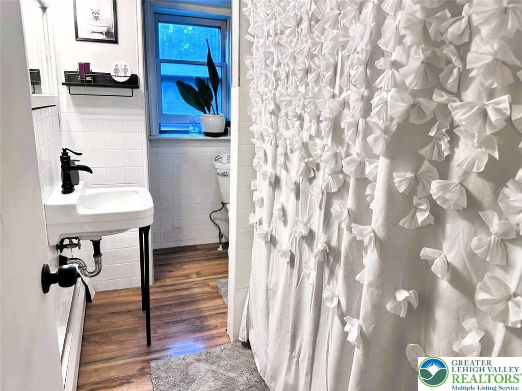 1250 Myrtle Road Walnutport, PA 18088 - Photo 21 of 30 a view of a hallway with wooden floor and furniture