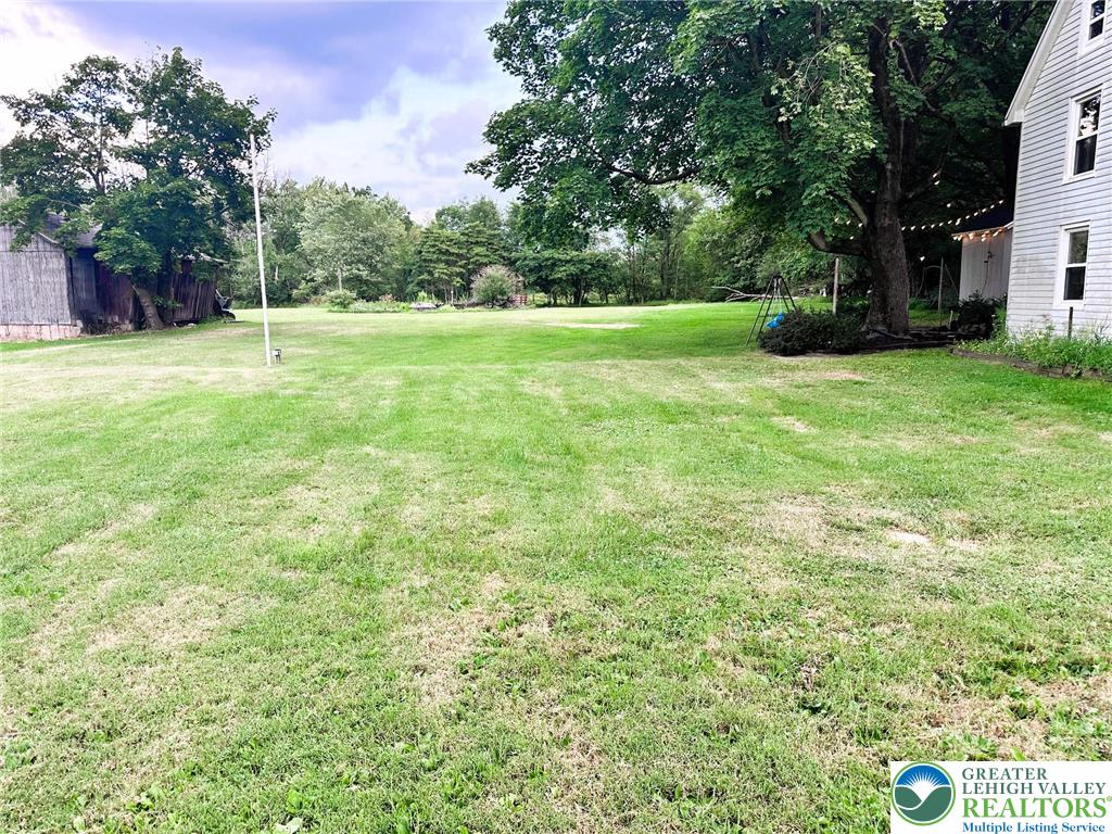 1250 Myrtle Road Walnutport, PA 18088 - Photo 24 of 30 a view of a grassy field with trees in the background