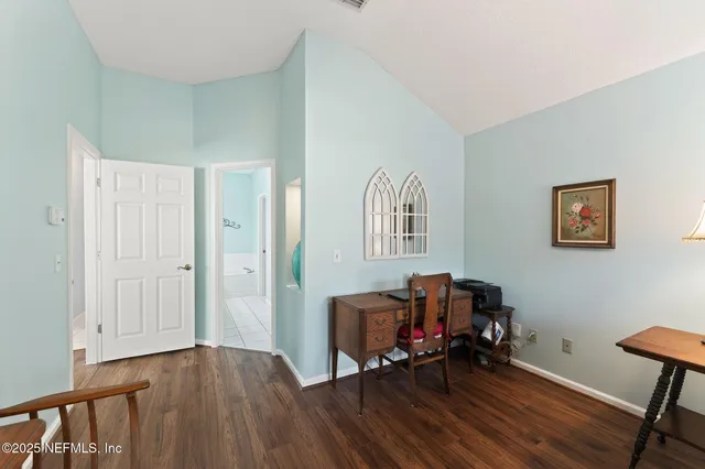 a view of a workspace with furniture and a workspace