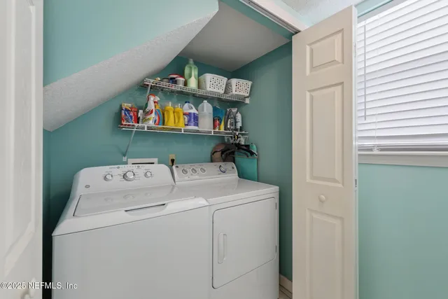 a utility room with dryer and washer