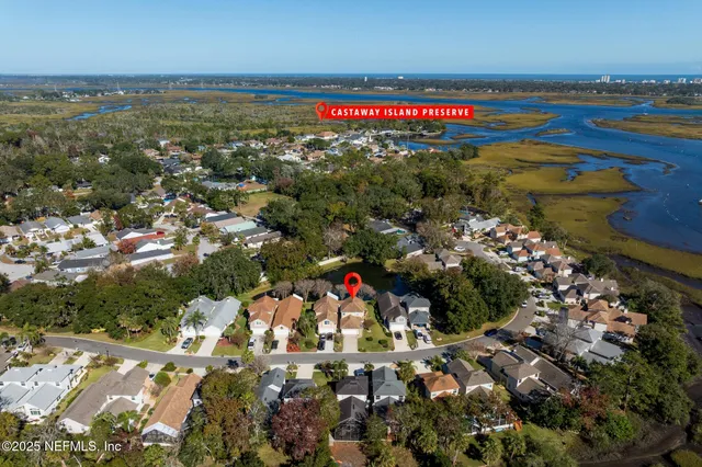 an aerial view of a house with a swimming pool