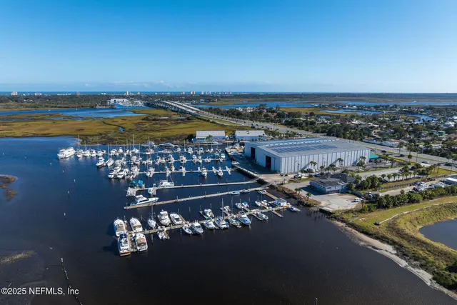 an aerial view of a house with a swimming pool