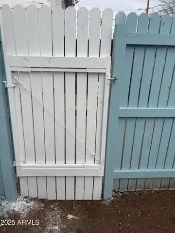 a white toilet sitting next to a shower curtain