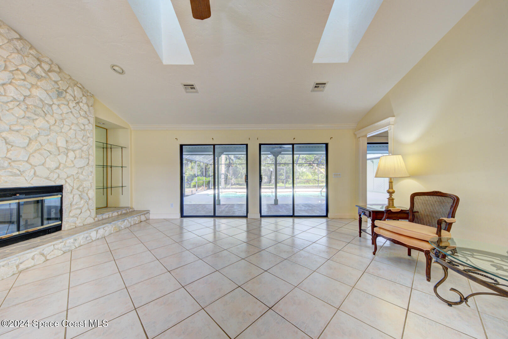4050 Quail Path Road Cocoa, FL 32926 - Photo 12 of 60 living room with sliders to lanai