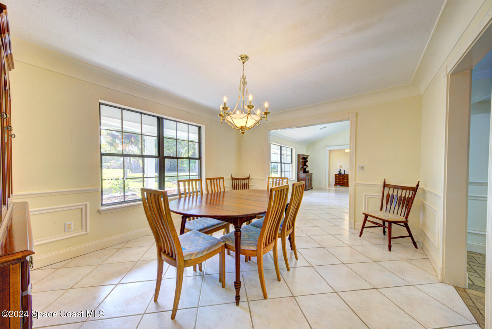 4050 Quail Path Road Cocoa, FL 32926 - Photo 15 of 60 dining room with chandelier