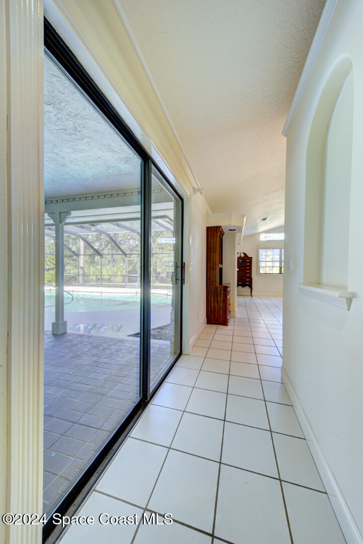 4050 Quail Path Road Cocoa, FL 32926 - Photo 24 of 60 master bedroom with slider to lanai