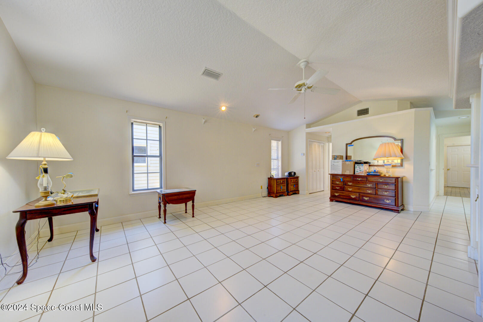4050 Quail Path Road Cocoa, FL 32926 - Photo 25 of 60 master bedroom with tile floor
