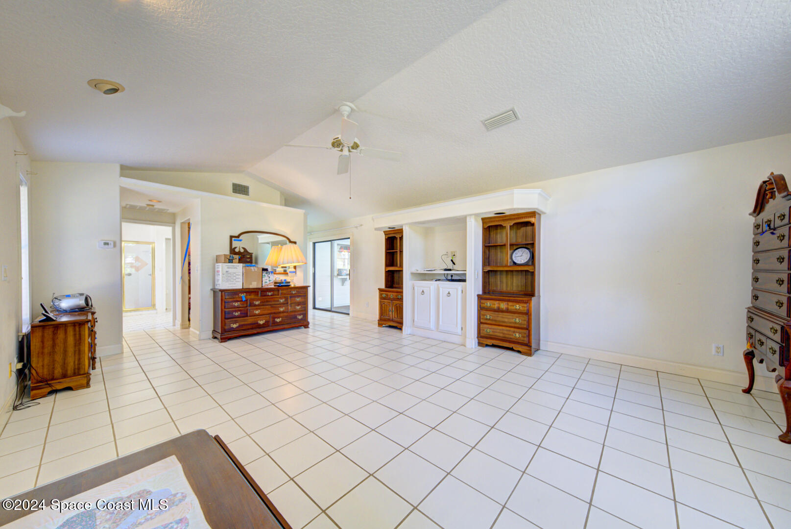 4050 Quail Path Road Cocoa, FL 32926 - Photo 26 of 60 master bedroom with ensuite
