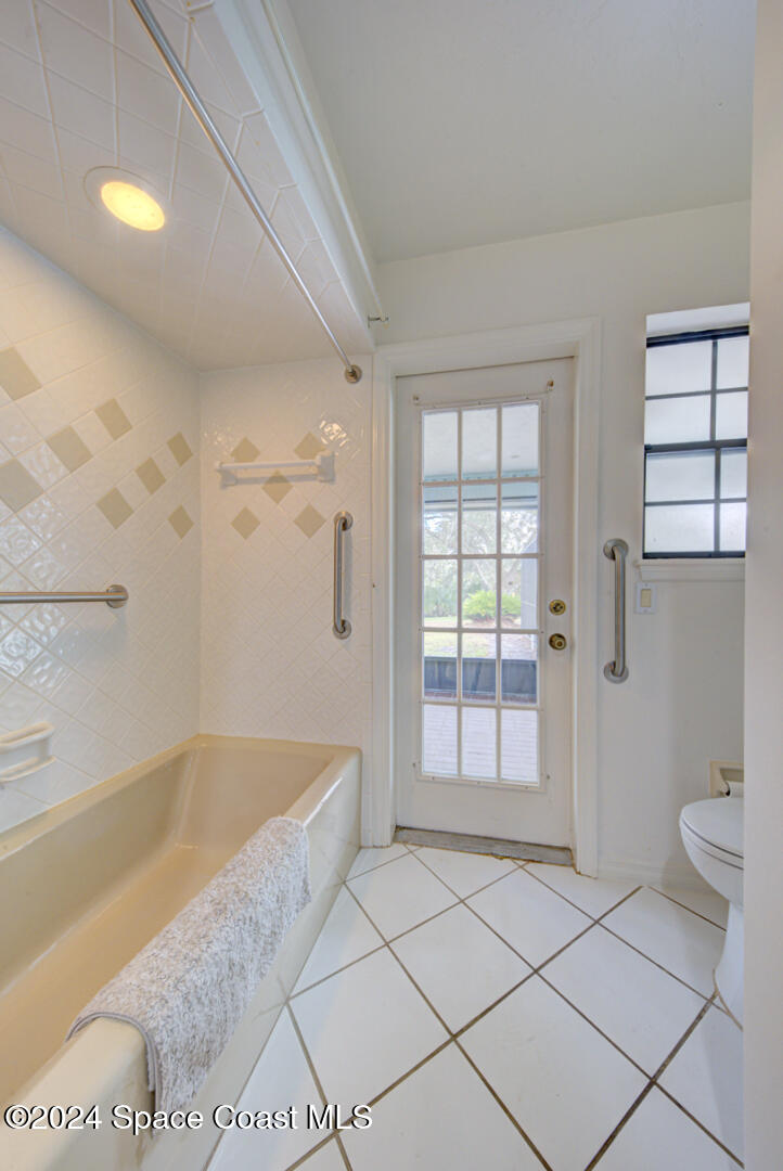 4050 Quail Path Road Cocoa, FL 32926 - Photo 36 of 60 bathroom 2 with cabana door
