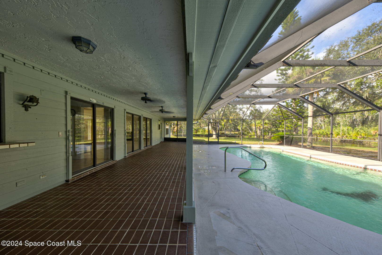 4050 Quail Path Road Cocoa, FL 32926 - Photo 43 of 60 lanai & swimming pool