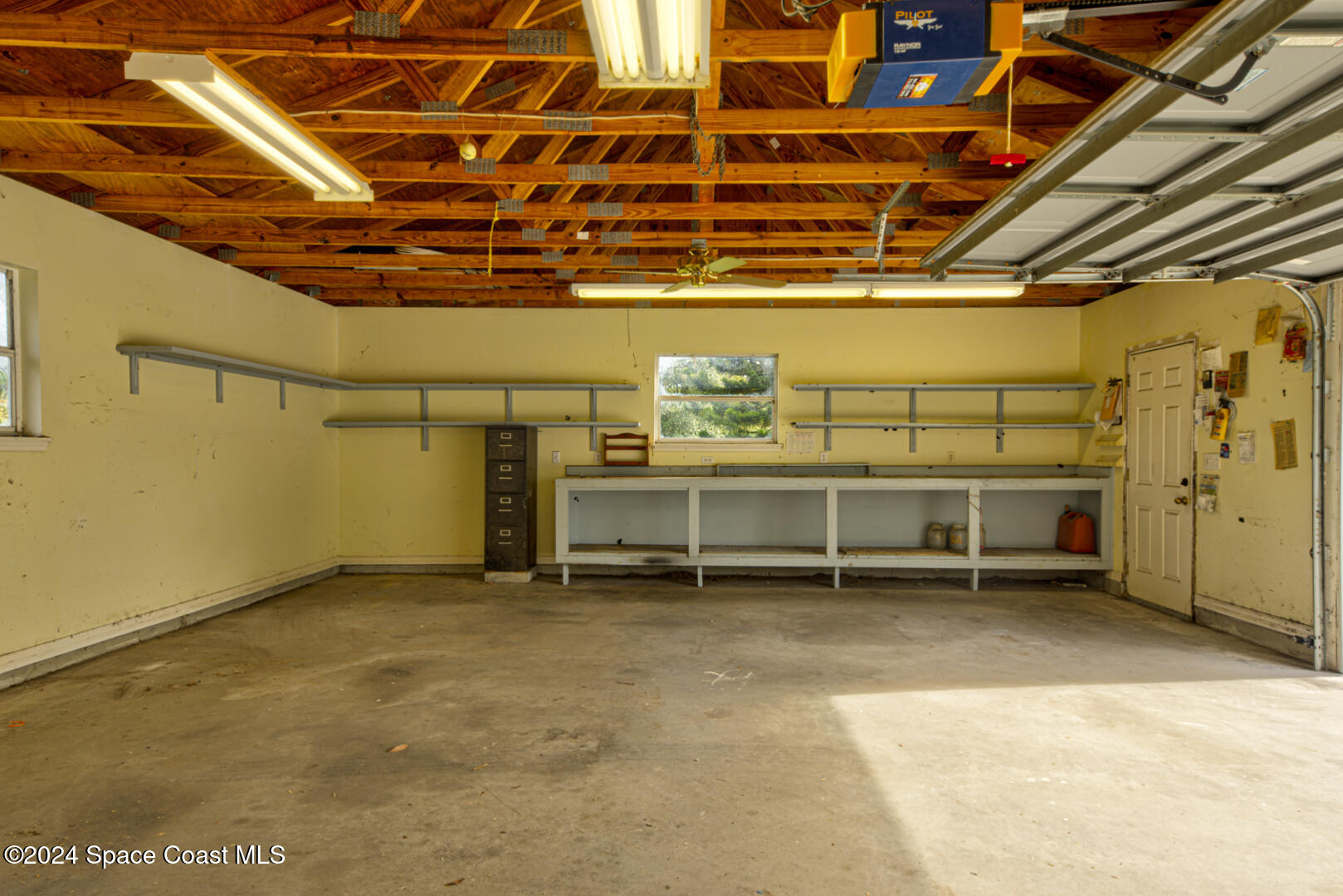4050 Quail Path Road Cocoa, FL 32926 - Photo 52 of 60 secondary garage with workbench