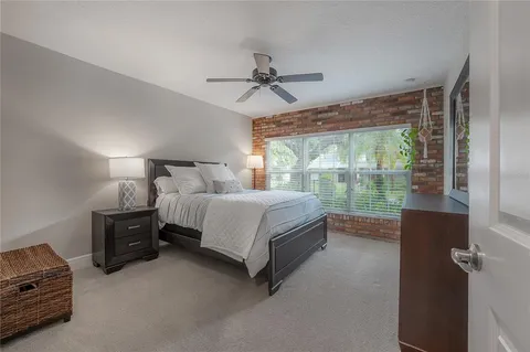 a bedroom with furniture and a window
