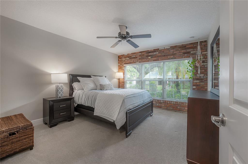 3108 West Villa Rosa Street Tampa, FL 33611 - Photo 35 of 58 a bed sitting in a bedroom next to a window