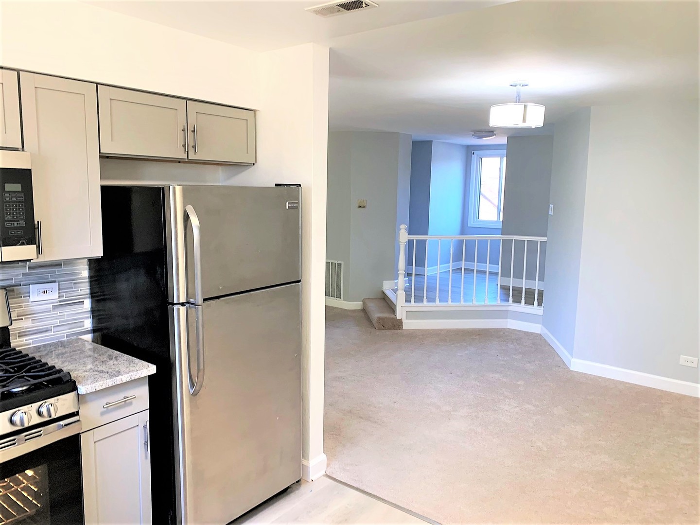 1741 Harrow Court, Unit B Wheaton, IL 60189 - Photo 12 of 24 a kitchen with a refrigerator and a stove