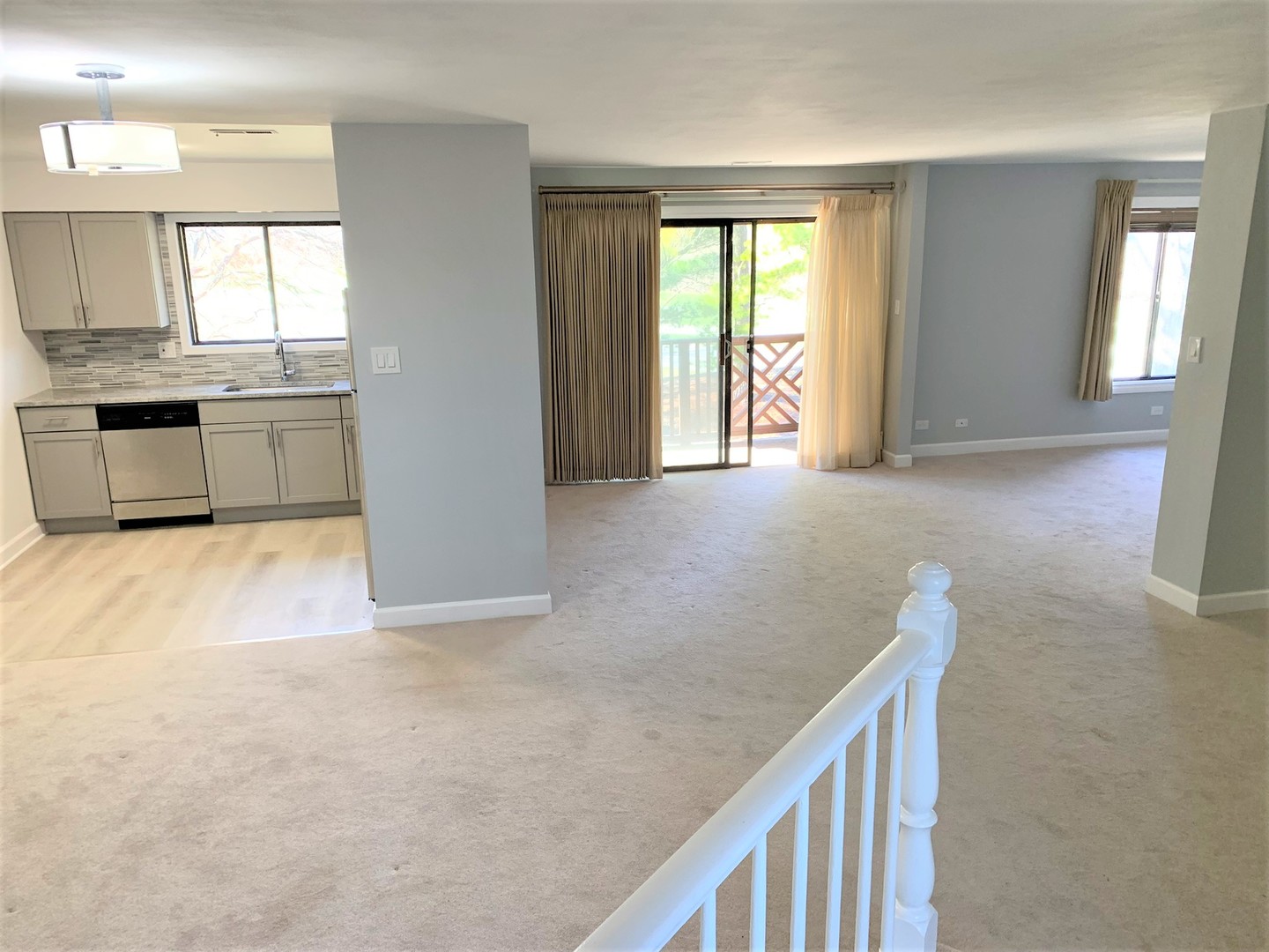 1741 Harrow Court, Unit B Wheaton, IL 60189 - Photo 2 of 24 a view of a kitchen with a sink and a window