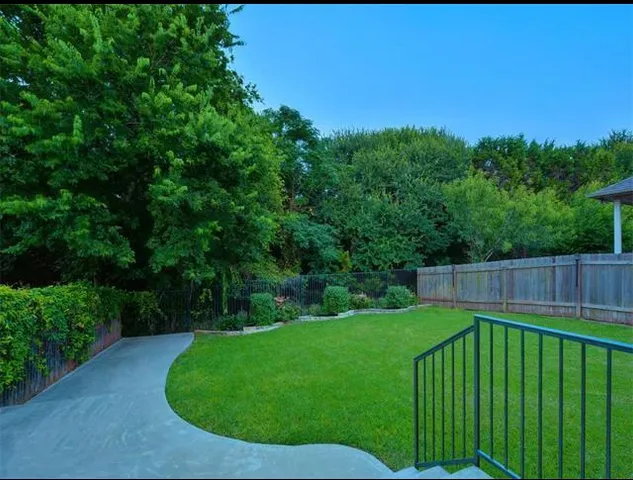 a view of a backyard with a garden