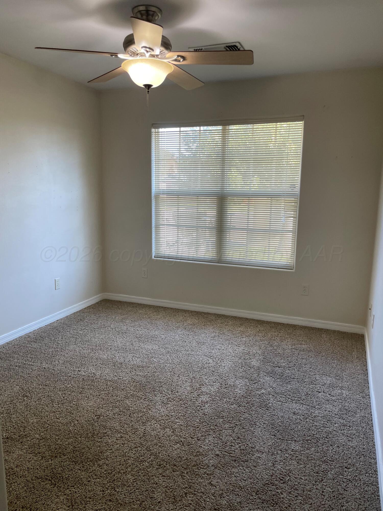 6001 Estacado Lane Amarillo, TX 79109 - Photo 15 of 21 an empty room with a window