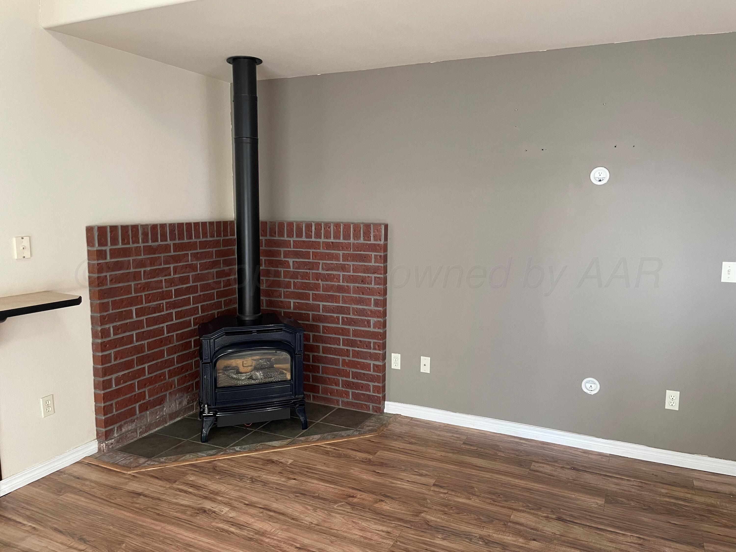 6001 Estacado Lane Amarillo, TX 79109 - Photo 5 of 21 a view of an empty room and wooden floor
