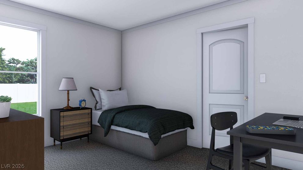 478 Box Canyon Road Alamo, NV 89001 - Photo 2 of 15 Natural light fills this cozy bedroom featuring soft carpeting and a clean trim design.