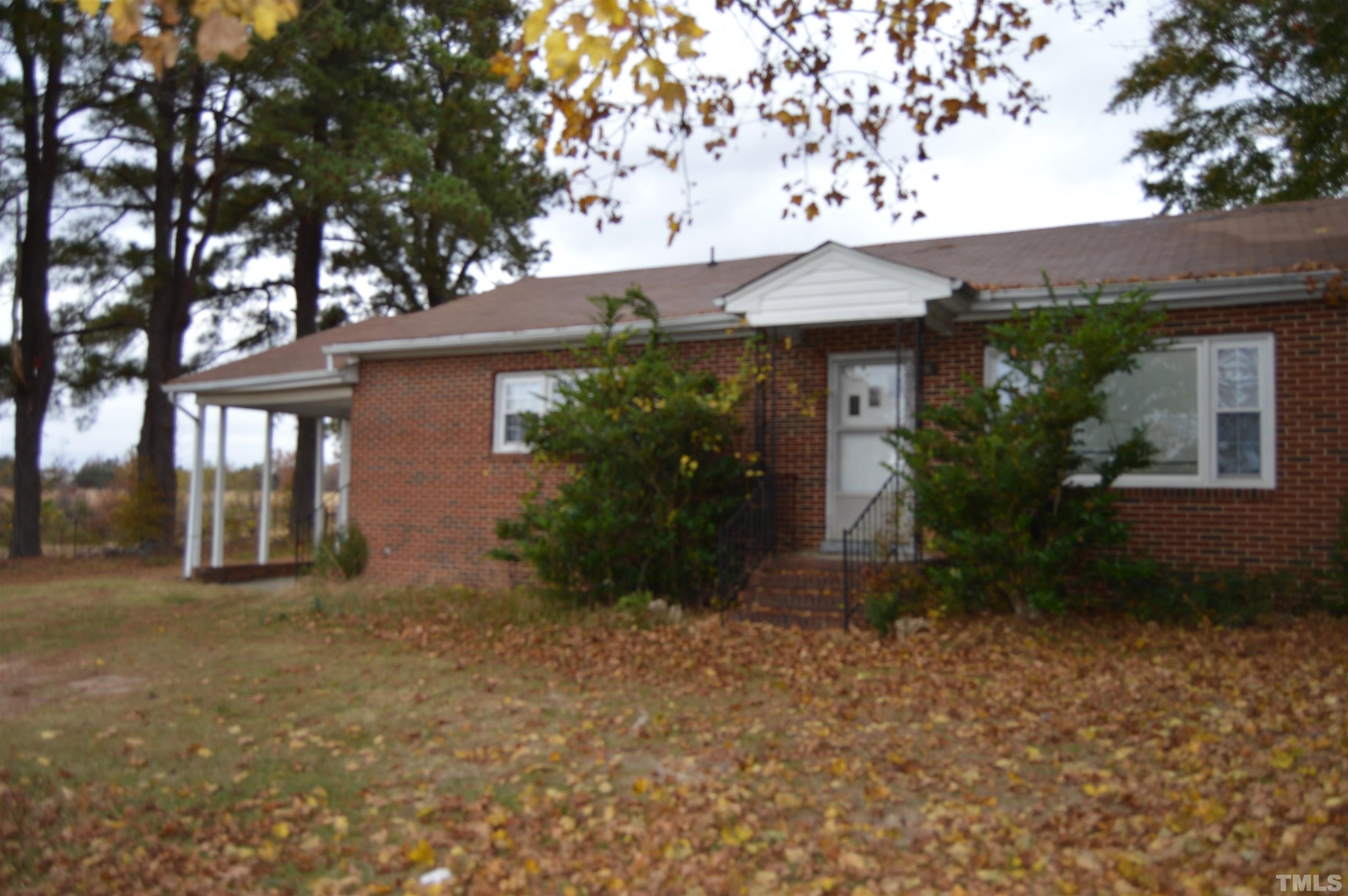 853 Lucy Garrett Road Roxboro, NC 27574 - Photo 3 of 9 a front view of house with yard and trees