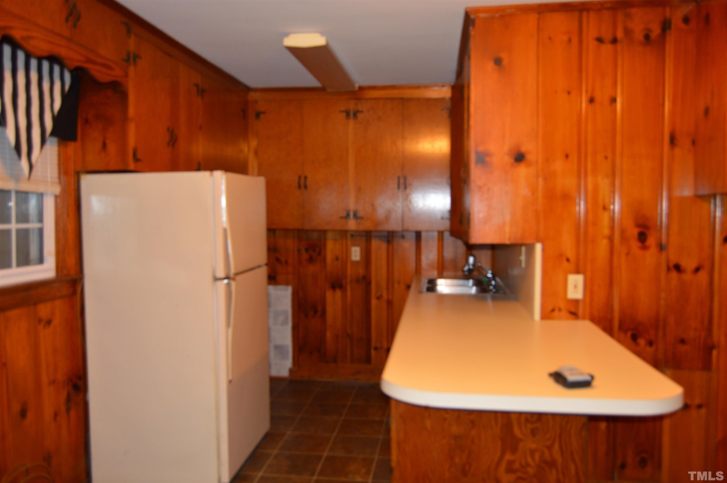853 Lucy Garrett Road Roxboro, NC 27574 - Photo 5 of 9 a bathroom with a sink and a large mirror