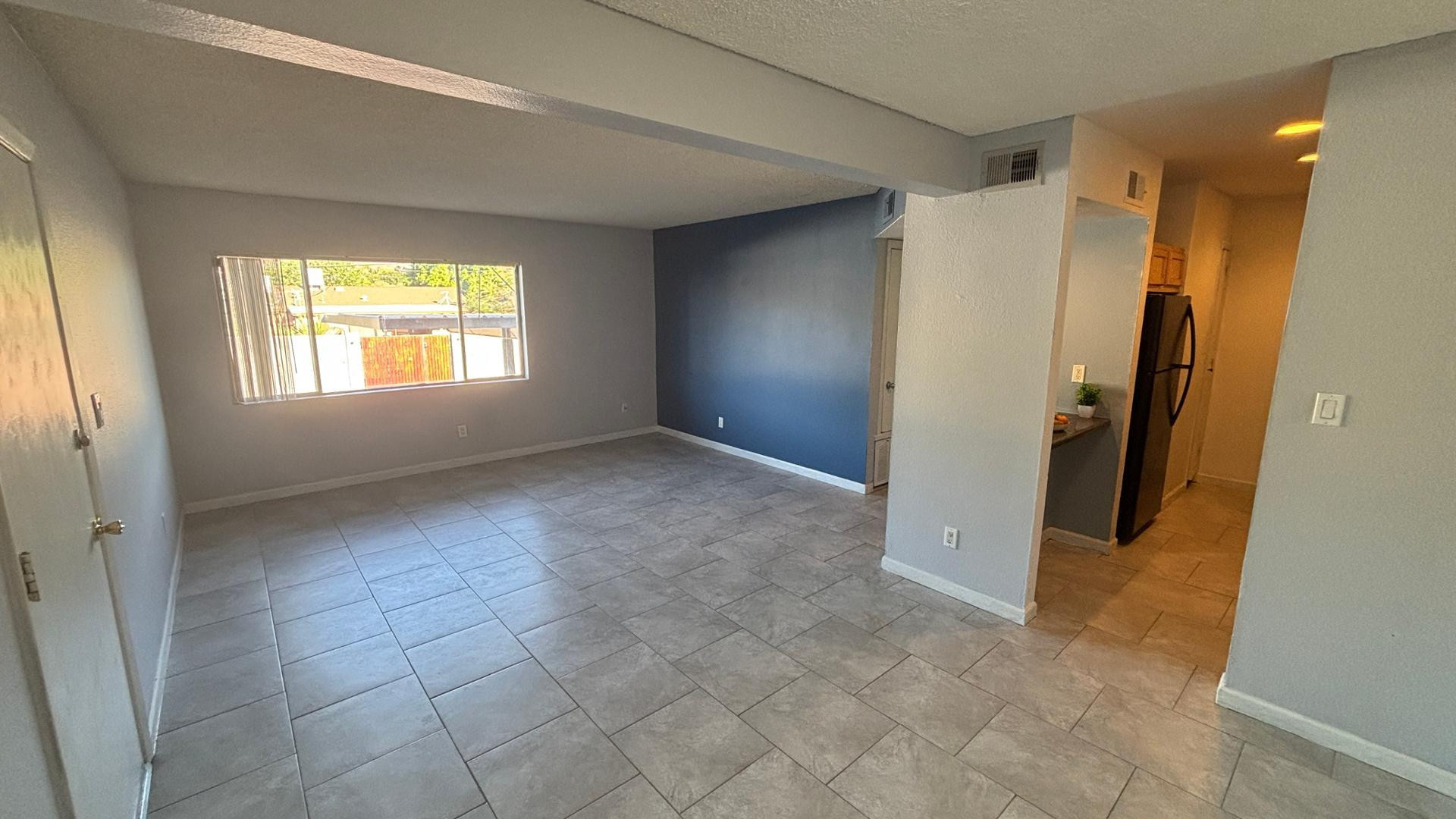 1130 East Butler Drive, Unit B4 Phoenix, AZ 85020 - Photo 3 of 17 a view of an empty room with a window