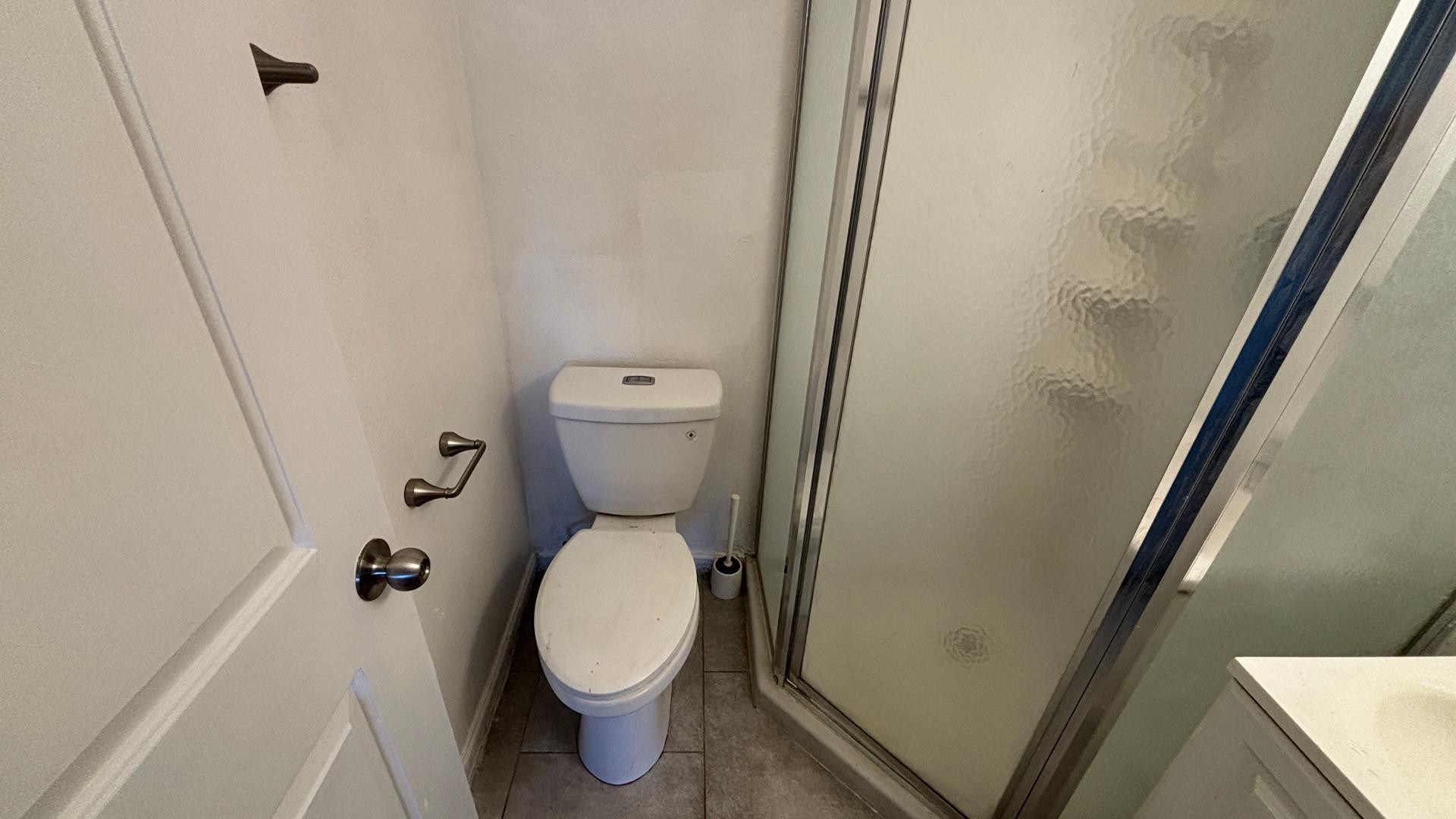 1130 East Butler Drive, Unit B4 Phoenix, AZ 85020 - Photo 10 of 17 a white toilet sitting next to a sink