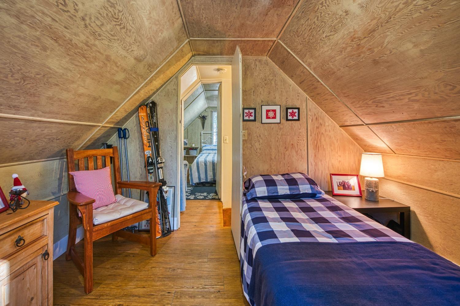 61347 Old Hunting Road Mono Hot Springs, CA 93634 - Photo 15 of 31 a bedroom with a bed and wooden floor