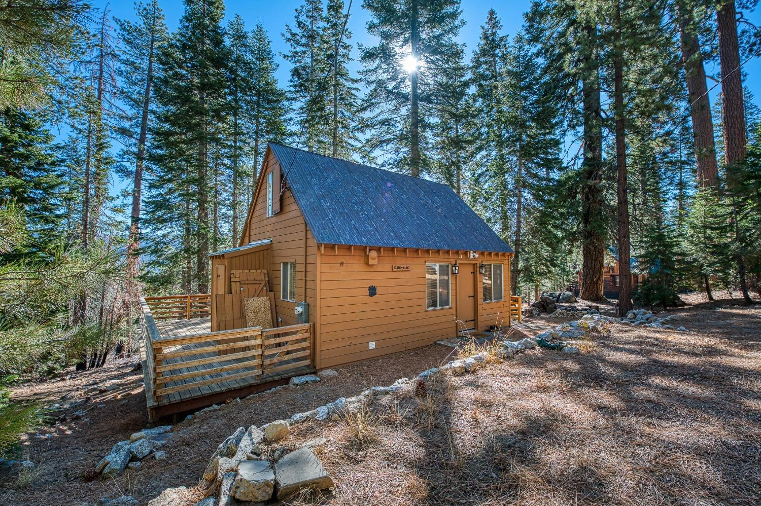 61347 Old Hunting Road Mono Hot Springs, CA 93634 - Photo 19 of 31 a view of a house with a yard and wooden fence