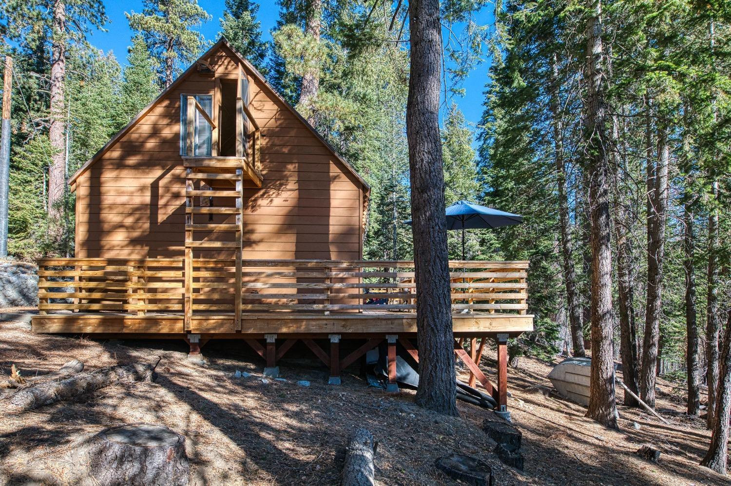 61347 Old Hunting Road Mono Hot Springs, CA 93634 - Photo 22 of 31 a view of a house with a yard and sitting area