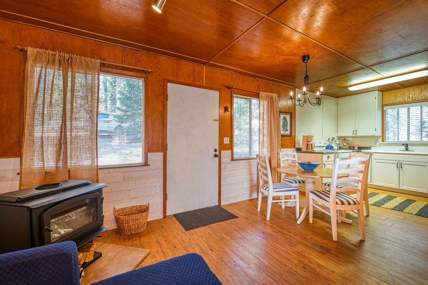 61347 Old Hunting Road Mono Hot Springs, CA 93634 - Photo 4 of 31 a dining room with furniture and wooden floor