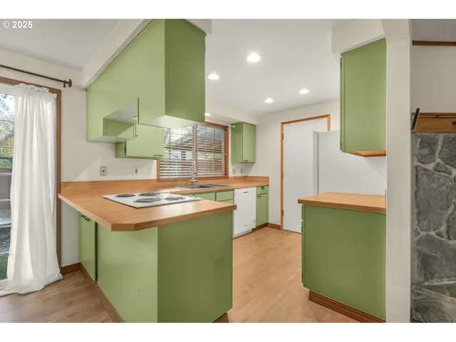 a kitchen with a sink and a refrigerator