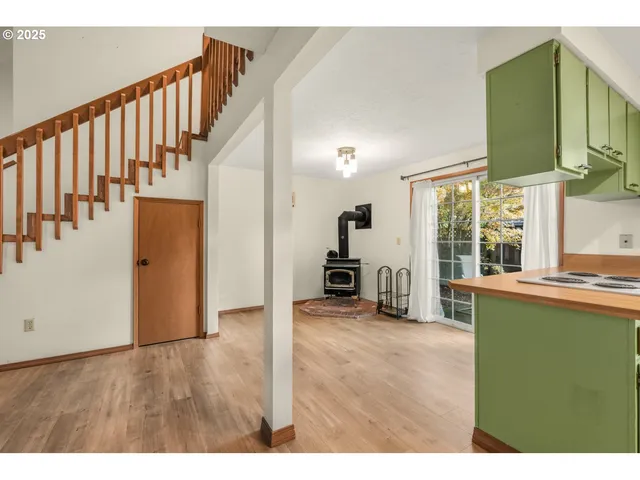 a room with kitchen island and a wooden floors