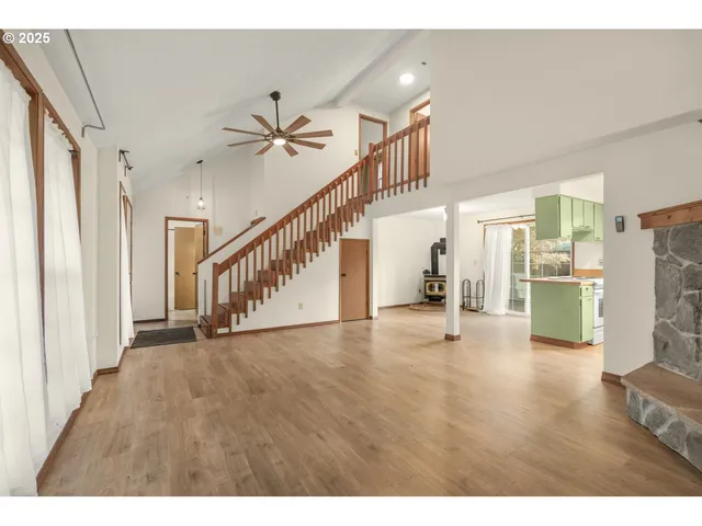 a view of an entryway with wooden floor