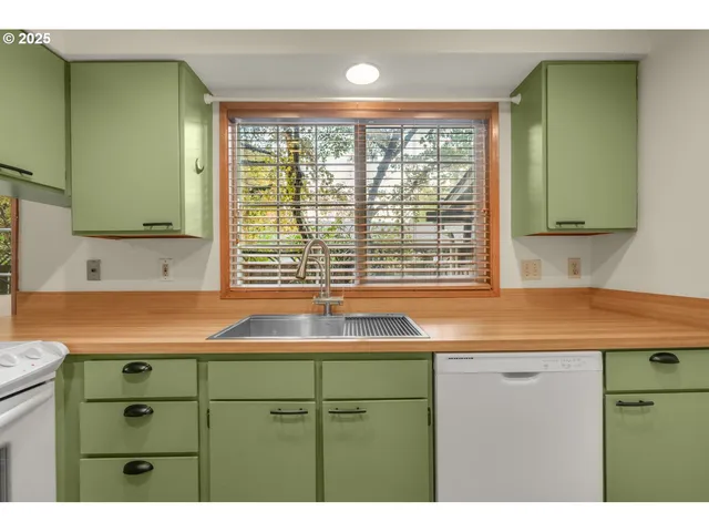 a kitchen with a sink and a window