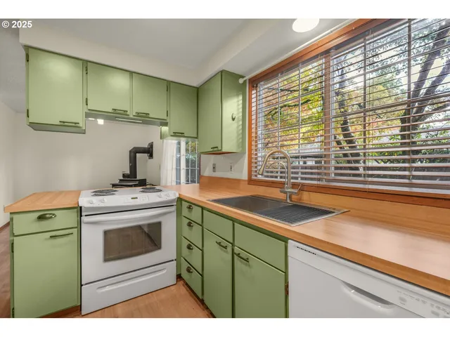 a kitchen with a sink and a stove