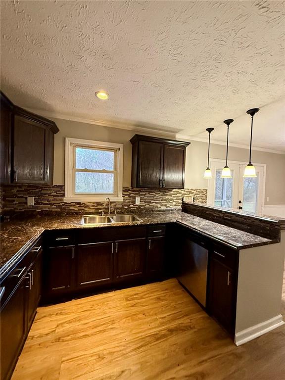 1801 Dews Pond Road Southeast Calhoun, GA 30701 - Photo 6 of 16 a kitchen with stainless steel appliances granite countertop a sink and cabinets