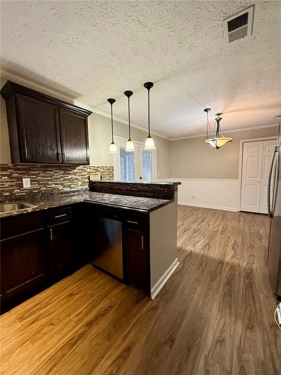 1801 Dews Pond Road Southeast Calhoun, GA 30701 - Photo 7 of 16 a kitchen with a sink cabinets and wooden floor