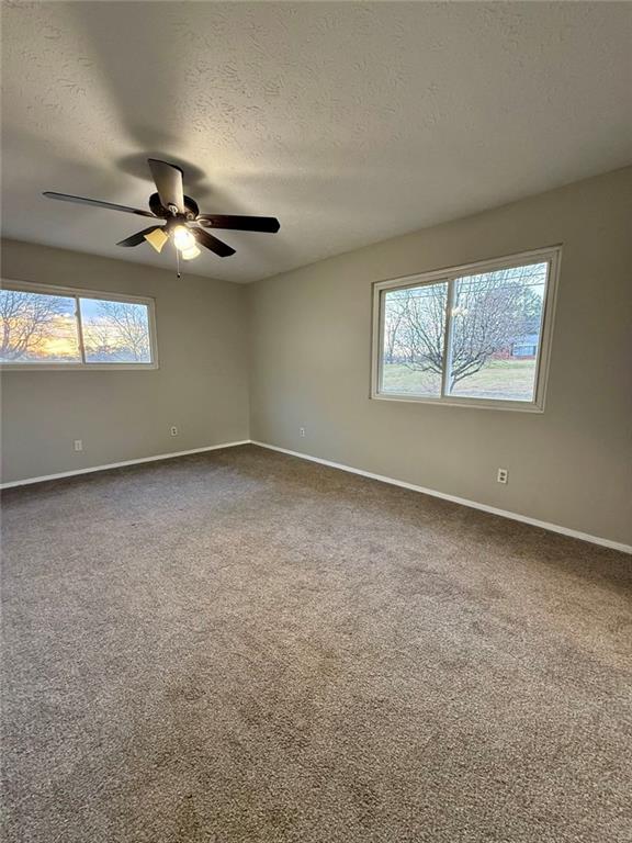 1801 Dews Pond Road Southeast Calhoun, GA 30701 - Photo 9 of 16 an empty room with windows