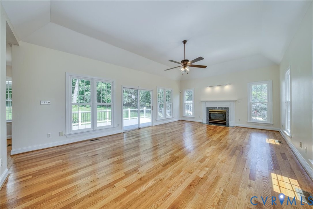 1813 Gildenborough Court Midlothian, VA 23113 - Photo 11 of 46 a view of empty room with wooden floor and fireplace