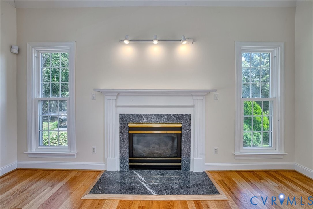 1813 Gildenborough Court Midlothian, VA 23113 - Photo 13 of 46 a view of an empty room with a fireplace and a window