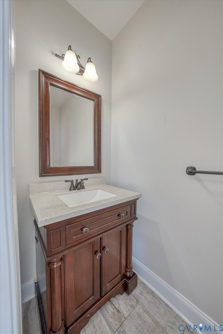 1813 Gildenborough Court Midlothian, VA 23113 - Photo 21 of 46 a bathroom with a granite countertop sink and a mirror