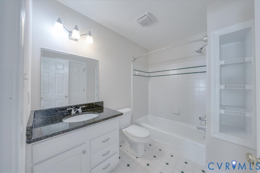 1813 Gildenborough Court Midlothian, VA 23113 - Photo 30 of 46 a bathroom with a granite countertop sink a toilet and shower